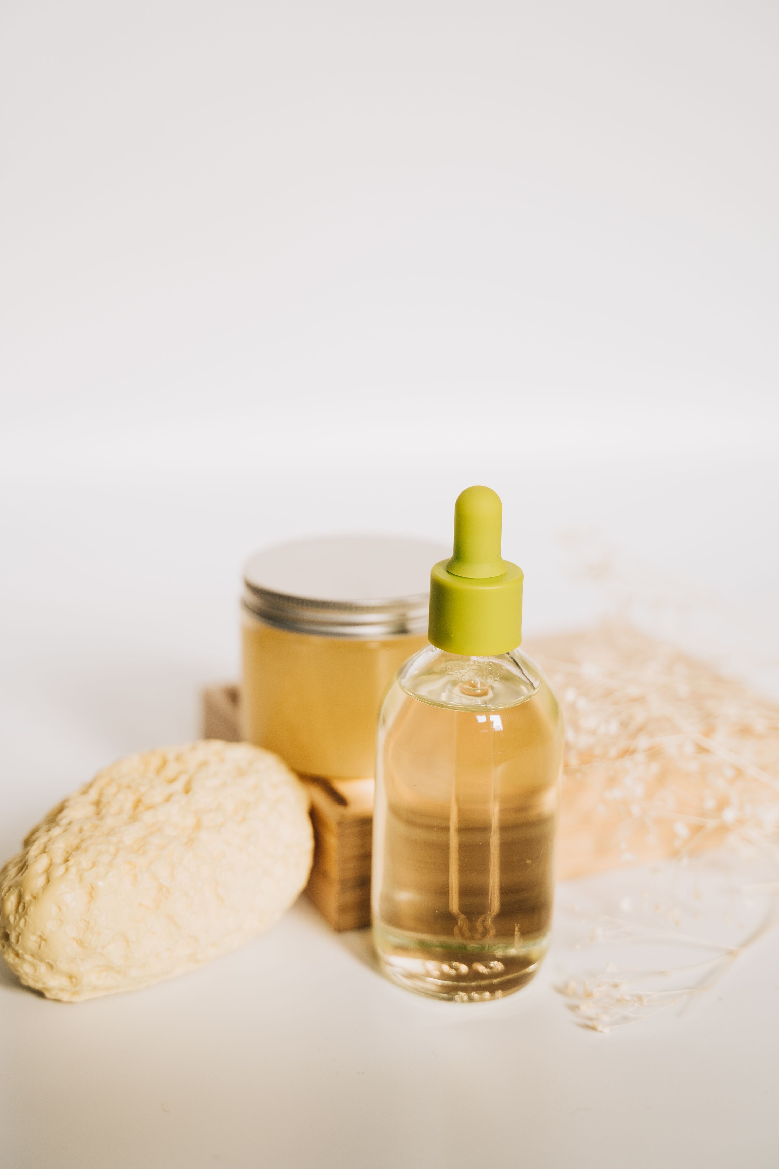 Frosted amber dropper bottle with botanical oil